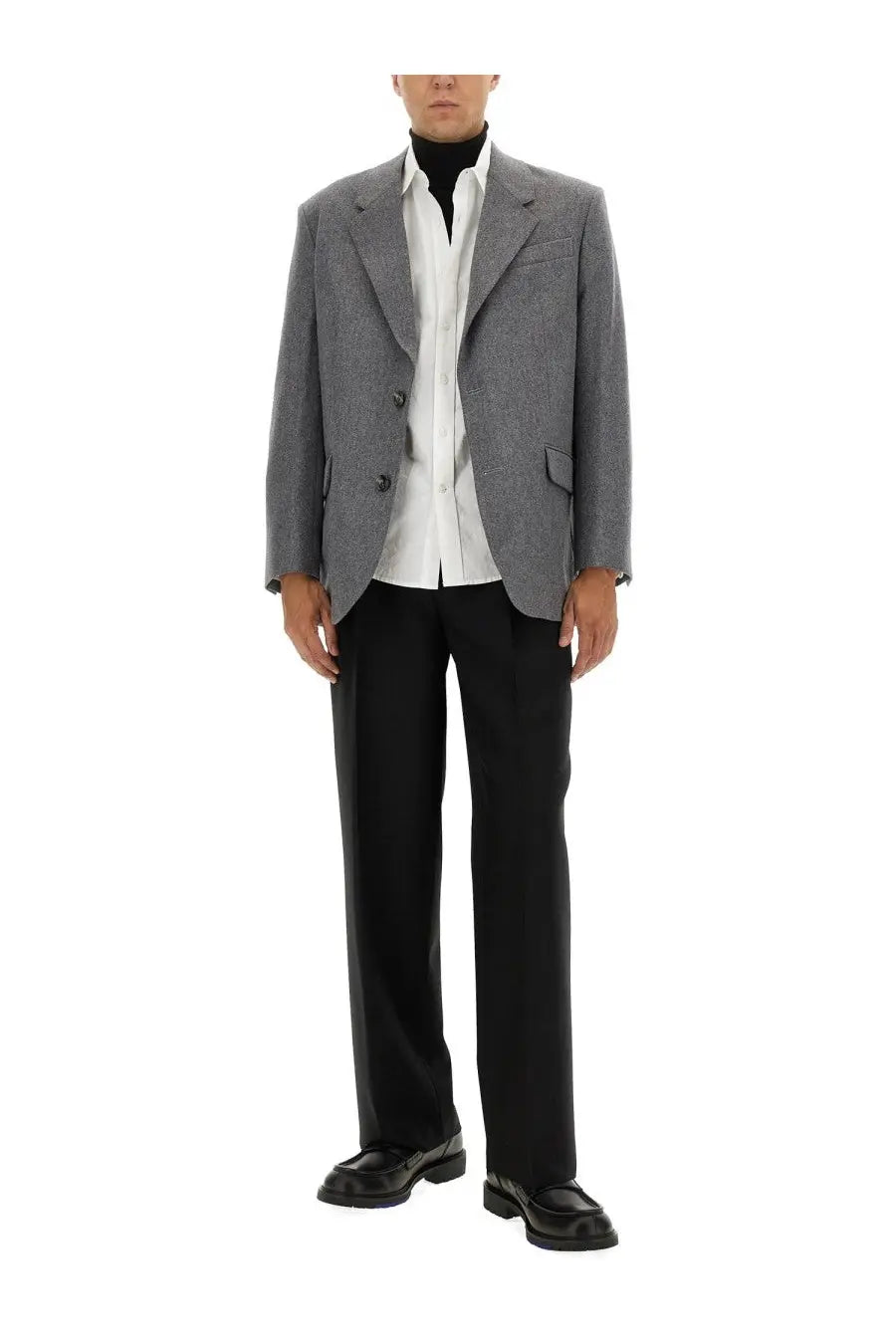 Ami Paris men’s double breasted grey wool blazer with subtle pattern worn over white shirt and black trousers