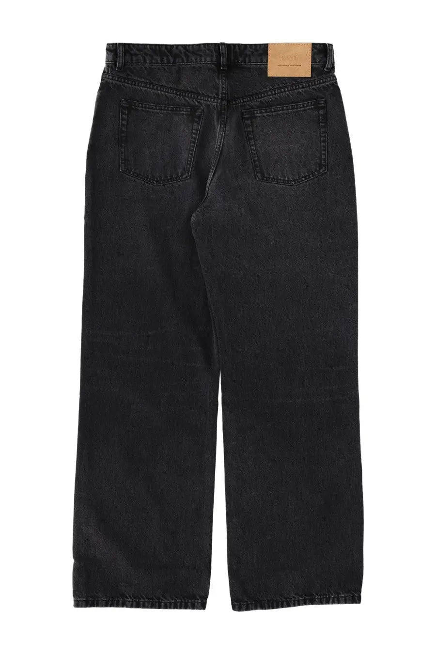 Back side of ami paris men’s large fit black denim jeans with faded wash and classic back pockets