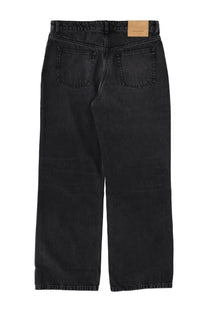 Back side of ami paris men’s large fit black denim jeans with faded wash and classic back pockets