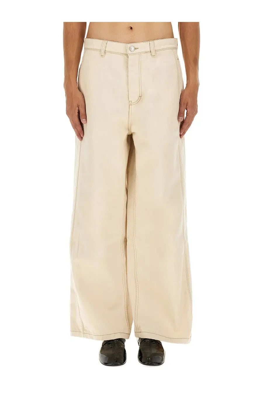 Cream-colored wide-leg denim trousers with a relaxed straight-cut silhouette and visible stitching details from Ami Paris