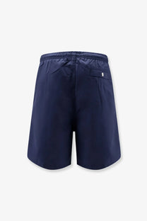 Back view of ami paris men’s navy blue nylon swimsuit with elastic waistband and small back pocket