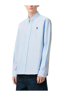 Ami Paris men’s light blue button-down shirt with a small black embroidered logo on the left chest