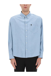 Ami Paris men’s light blue button-down shirt with subtle embroidered logo on the chest pocket
