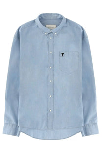 Ami Paris men’s light blue denim button-down shirt with subtle texture white buttons and black embroidered logo on chest pocket
