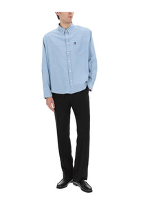 Ami Paris men’s light blue long-sleeved button-down shirt with small embroidered logo on chest pocket