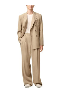 Beige double-breasted blazer with structured shoulders and gold-toned buttons paired with ami paris men’s straight beige pants