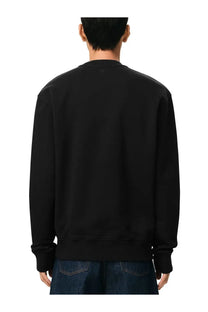 Ami Paris men’s black crewneck sweatshirt with ribbed cuffs and hem featuring a subtle logo at the neckline