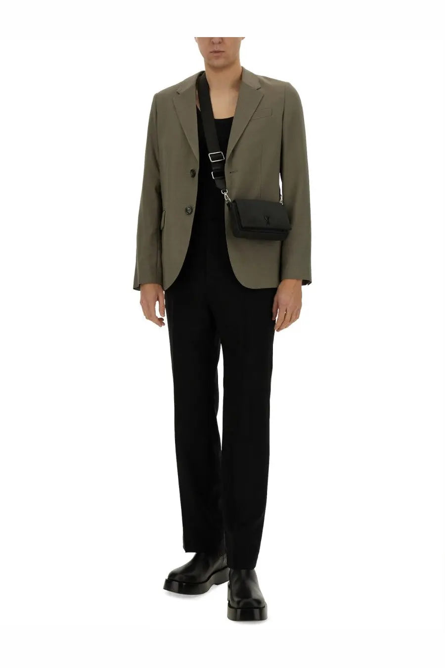Black crossbody bag with minimalist design and subtle logo detail complementing ami paris men’s green two button jacket