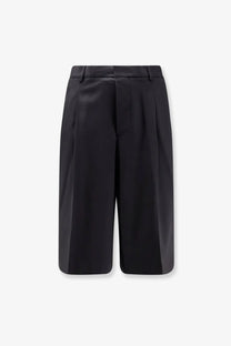 Ami Paris men’s black virgin wool shorts with a tailored structured fit and pleated design