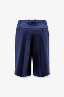 Navy blue tailored virgin wool shorts by Ami Paris showing back with sleek structure and subtle pleats
