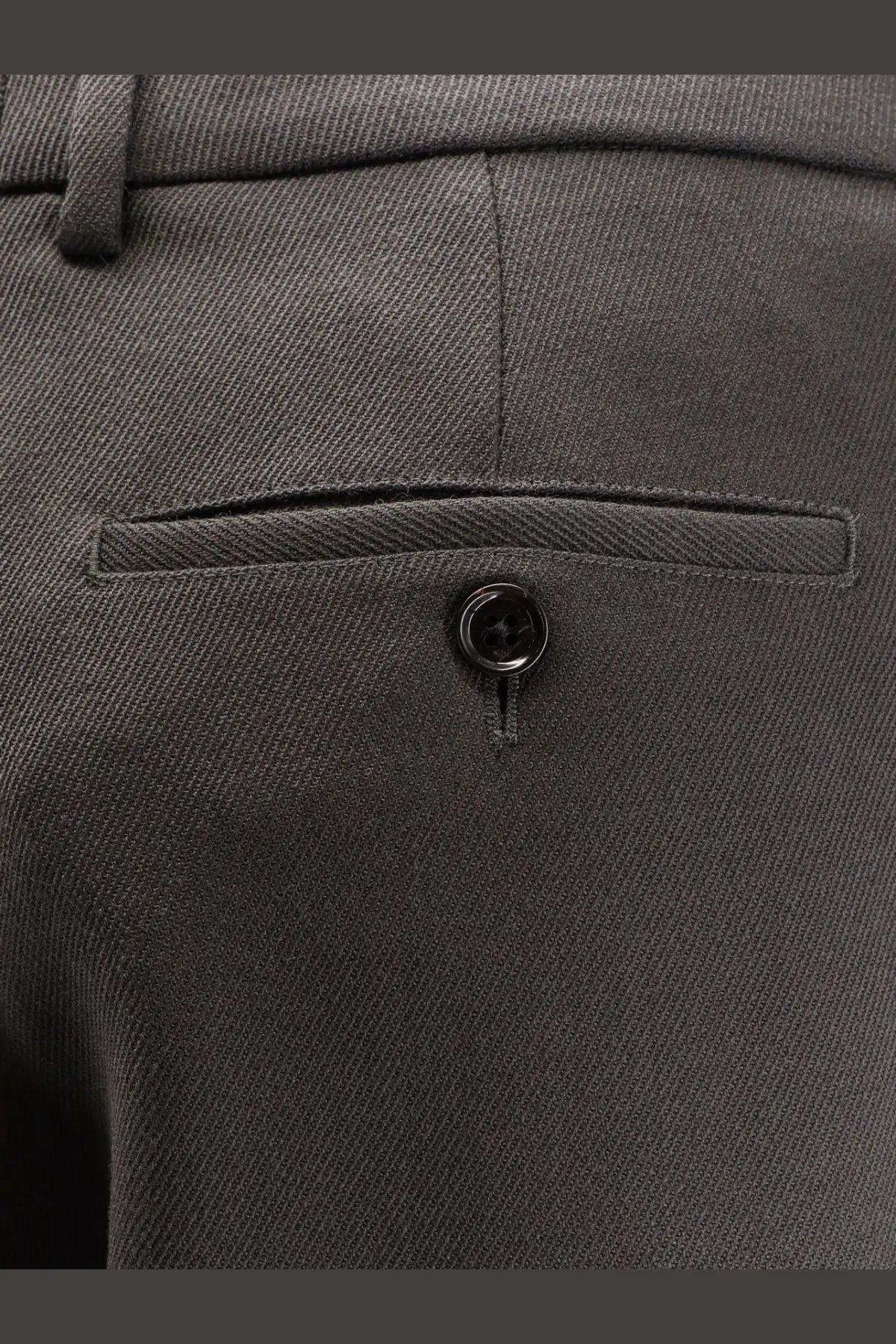 Back view of ami paris men’s virgin wool dark gray trousers with subtle diagonal weave and black button pocket detail
