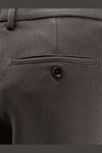 Back view of ami paris men’s virgin wool dark gray trousers with subtle diagonal weave and black button pocket detail