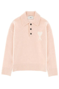 Ami Paris unisex ami de coeur polo shirt pink knit sweater with white heart logo and black buttons down the front