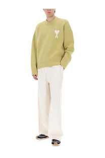 Ami Paris unisex jersey oversized knit sweater in pale green with a white heart logo featuring an a inside