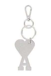 Silver heart-shaped keychain with stylized a cutout and polished metallic finish attached to a carabiner clip by ami paris