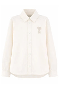 Ami Paris unisex cream overshirt with long sleeves and subtle embroidered bear motif on left chest