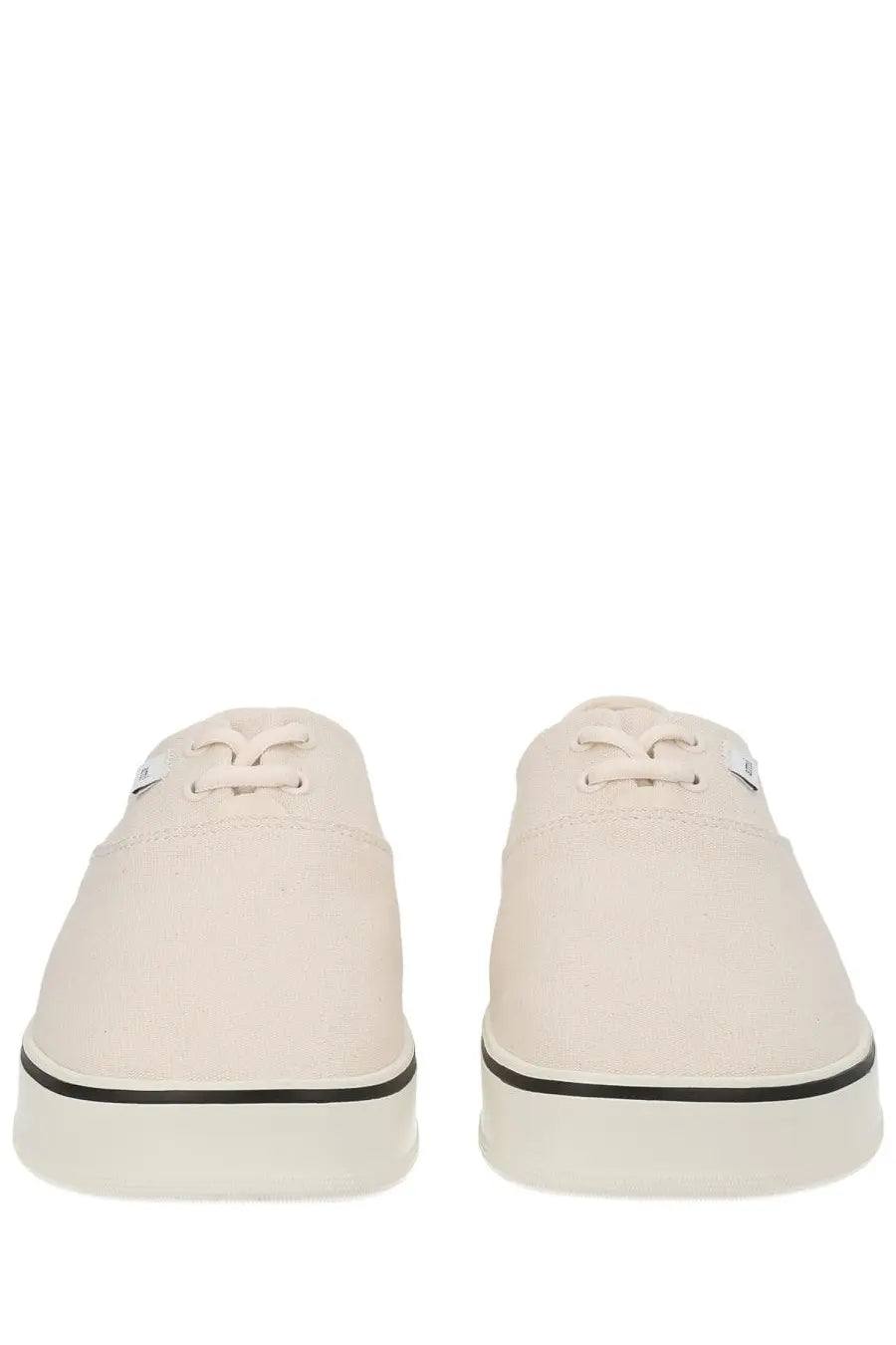 Cream-colored canvas ami paris unisex tennis sneakers with black rubber soles and laces in white
