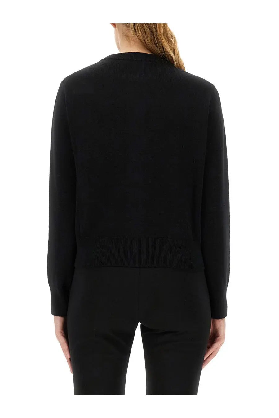 Black long-sleeved knit cardigan with ribbed waistband from Ami Paris women’s Ami DE Coeur collection