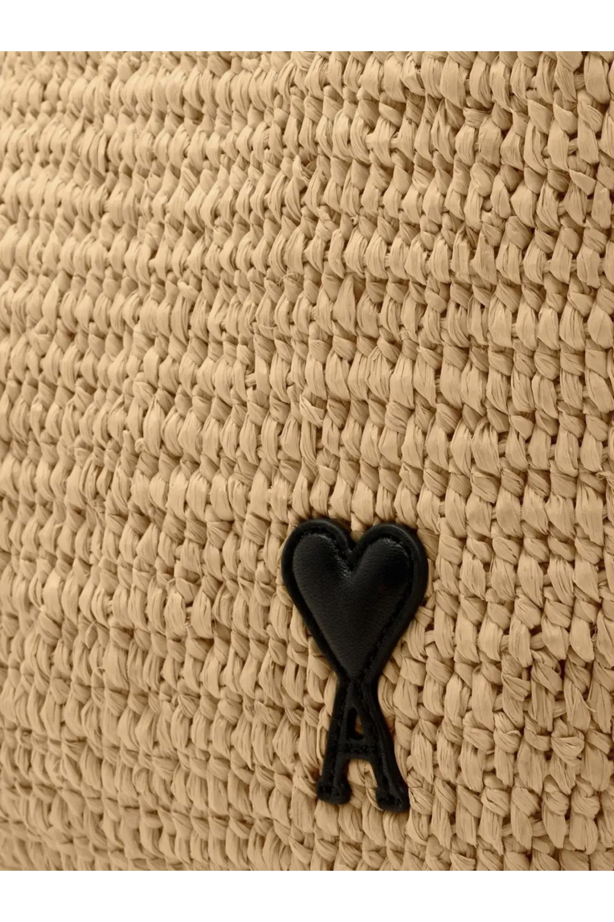 Beige woven straw ami paris women’s raffia shoulder bag with black heart shaped logo and a underneath in white
