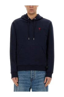 Ami Paris women’s navy blue cotton hoodie with red embroidered logo on chest and white aglets on drawstrings