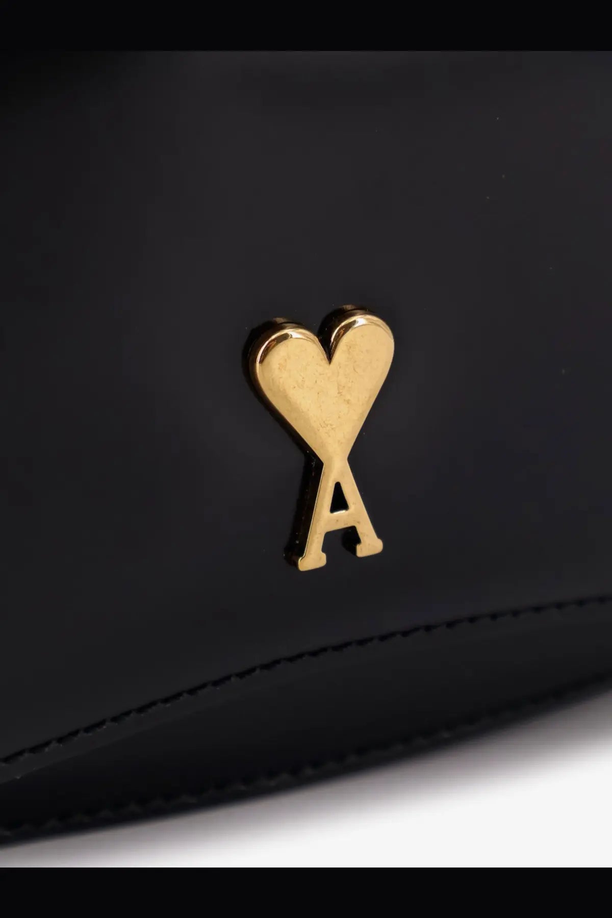 Ami Paris women’s black leather shoulder bag clutch with gold-tone heart shaped logo featuring an a at base