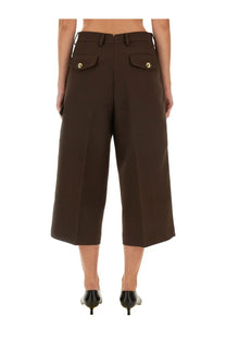 Back side of ami paris women military bermuda brown wide-leg cropped trousers with gold-toned button accents on pockets