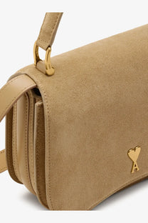 Ami Paris women’s beige suede crossbody bag with gold-tone heart-shaped logo and matching hardware