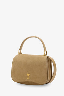 Beige suede crossbody bag by ami paris with gold-tone heart logo and matching handle perfect for daily use