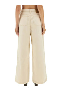 Beige wide-leg denim trousers with a high waist and classic back pockets designed by Ami Paris shown from the back