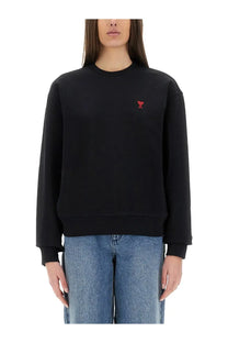 Ami Paris women’s black crewneck sweatshirt with a small red embroidered heart logo on the left chest