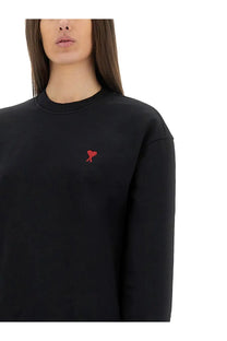 Ami Paris women’s black crewneck sweatshirt with a small red embroidered heart logo on the left chest