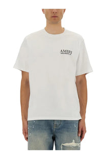 White amiri men’s bones stacked print t-shirt with black amiri hollywood ca logo on the left chest