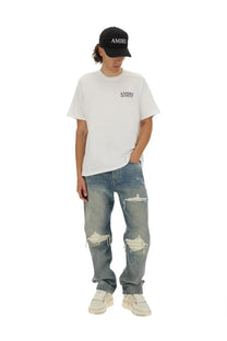 White amiri men’s bones stacked print t-shirt with subtle black logo on the chest in soft cotton fabric
