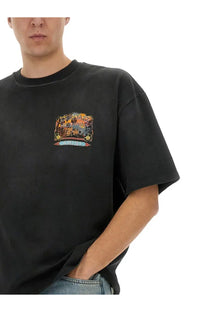 Black oversized AMIRI men’s jazz Hideaway shirt featuring a colorful vintage-style graphic print with jazz and America text