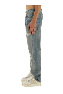 Amiri men’s jeans mx1 blue distressed light-wash denim with intentional rips at the knees and faded detailing