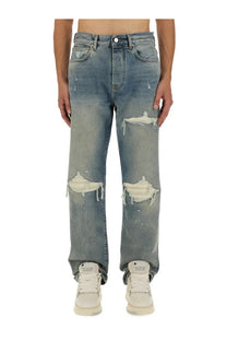 AMIRI men’s jeans mx1 blue distressed medium-wash denim with ripped knees and frayed edges