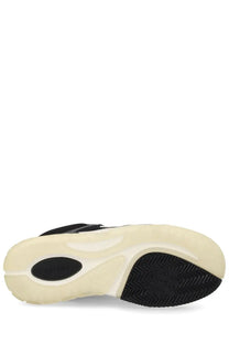 Amiri men’s sneaker in black with cream accents featuring a textured rubber sole for durability and style