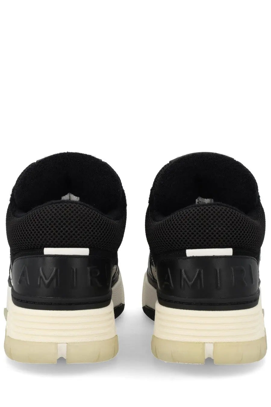 Back view of amiri men’s sneaker ma black with mesh upper cream rubber sole and embossed branding on heel