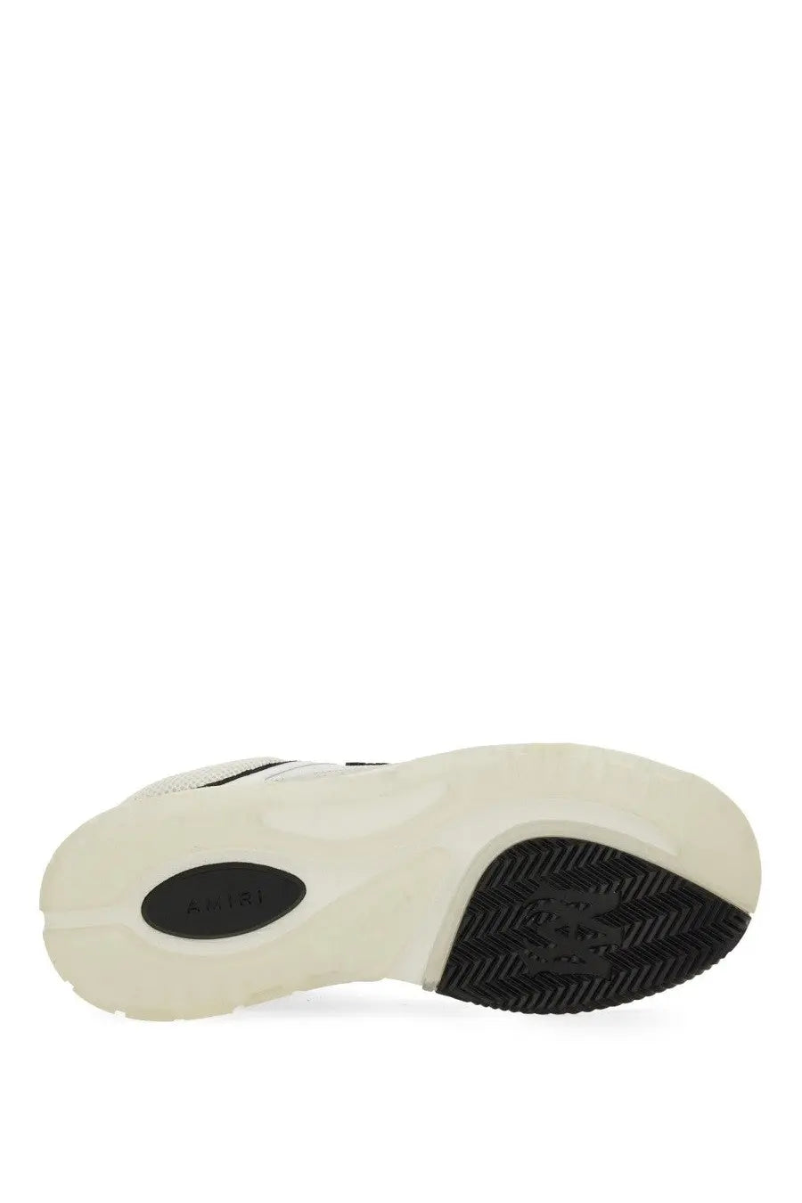 Back view of amiri men’s white and black athletic sneaker with chunky sole and ariat embossed patch near the heel