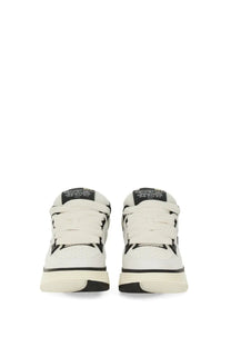 Amiri men’s sneaker ma white low-top with black accents featuring stitched detailing and textured rubber sole