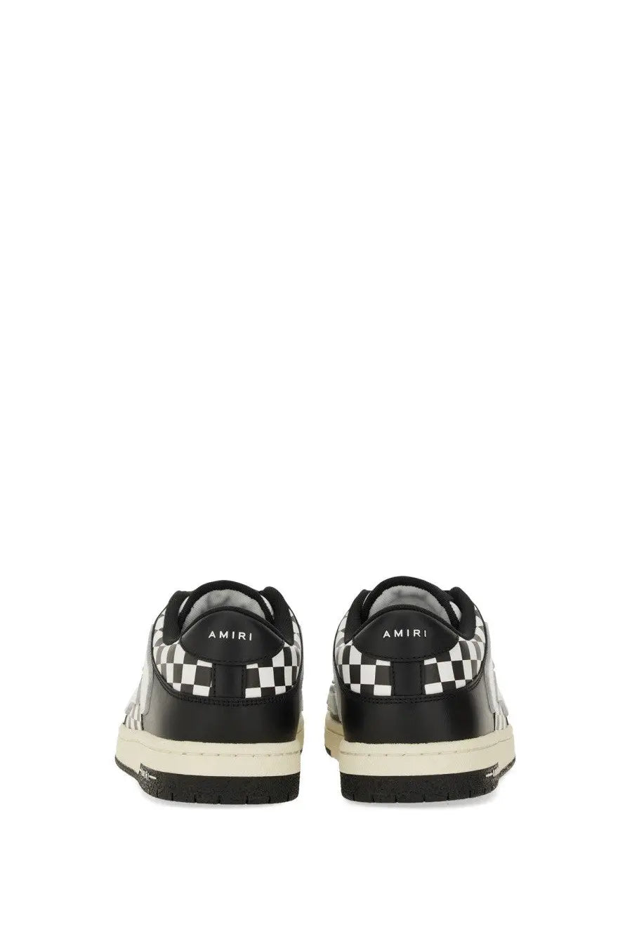 Amiri men’s black leather sneaker with bold black and white checkerboard heel and side panels and off-white sole