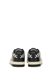 Amiri men’s black leather sneaker with bold black and white checkerboard heel and side panels and off-white sole