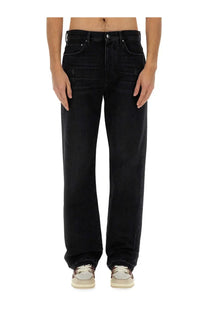Amiri men’s black denim jeans with a straight leg cut and subtle distressed details front view