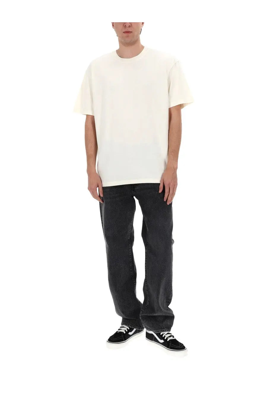 A plain off-white short-sleeved crew neck t-shirt made of soft cotton fabric paired with Amish Supplies men’s denim black jeans