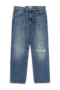 Blue denim amish supplies men’s jeans with distressed patches and red white and blue tag on right pocket