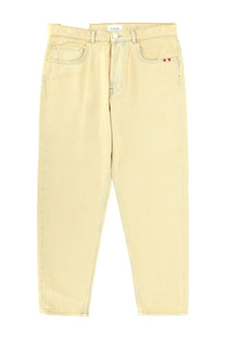 Beige denim jeans with a subtle red logo on the right front pocket from amish supplies mens jeans jeremiah harley beige collection