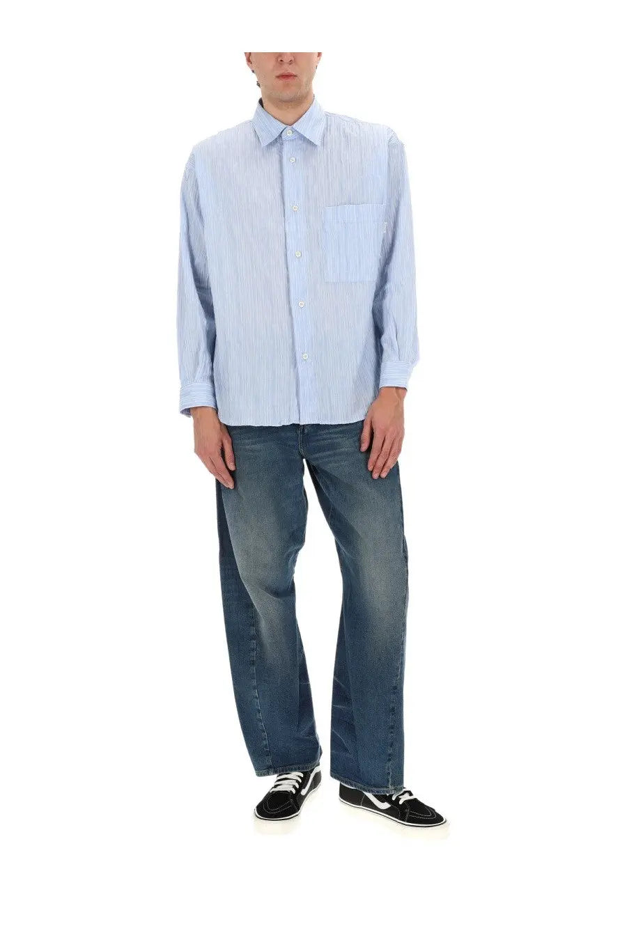 Light blue and white striped button-up shirt with chest pocket paired with amish supplies men’s jeans twist slub blue