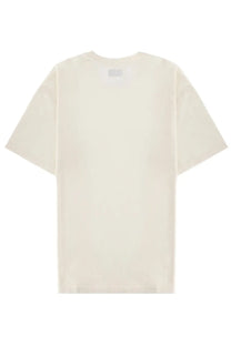 Cream-colored oversized cotton t-shirt with minimalist design and subtle brand tag at neckline from Amish Supplies