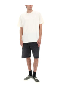 Off-white cotton t-shirt with relaxed fit and crew neckline shown with amish supplies men’s shorts tommy black