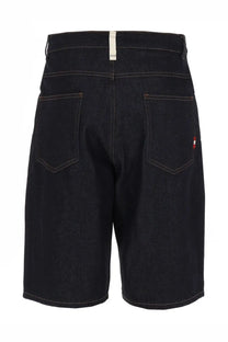 Dark indigo denim amish supplies men’s shorts with white waistband label and subtle red embroidery on right back pocket